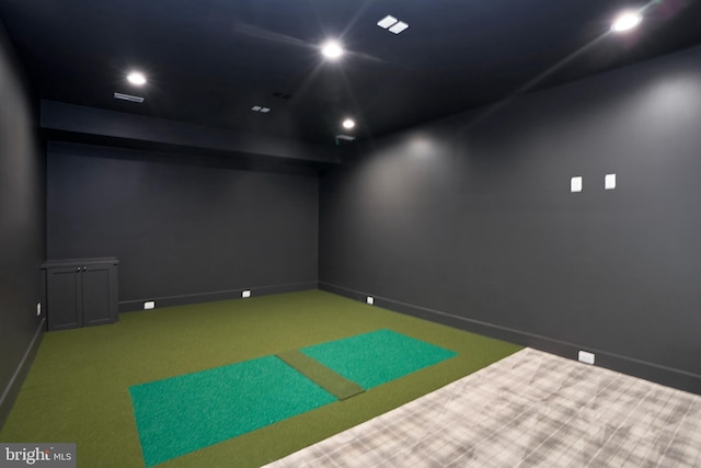 playroom with recessed lighting, baseboards, and golf simulator