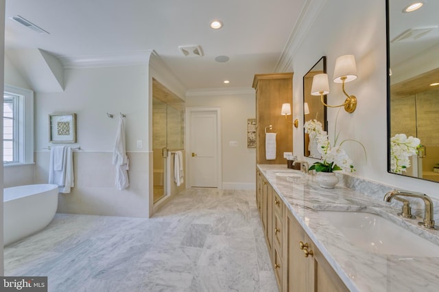 bathroom with double vanity, a shower stall, visible vents, crown molding, and a sink