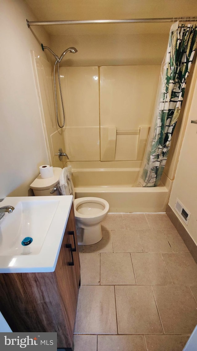 full bathroom featuring shower / tub combo with curtain, vanity, toilet, and tile patterned flooring