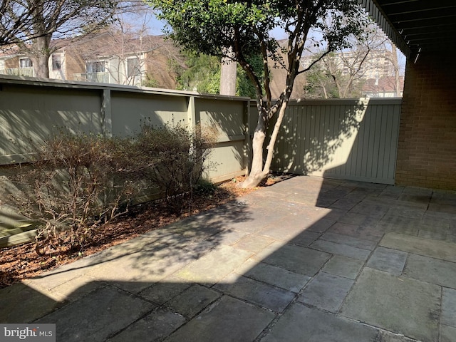 view of patio featuring fence