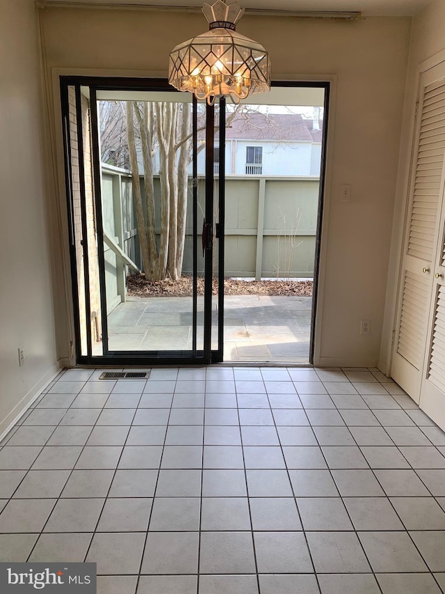 interior space featuring plenty of natural light and light tile patterned floors