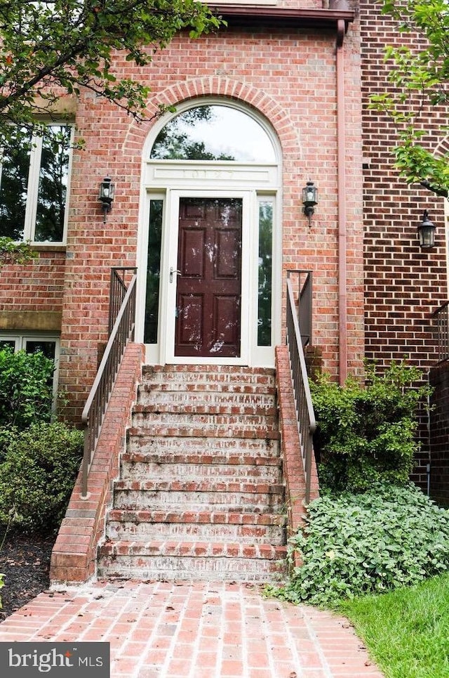 entrance to property with brick siding