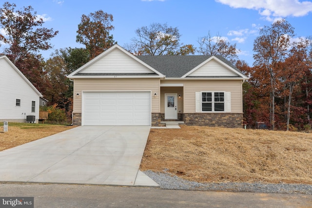 view of front facade with central AC and a garage