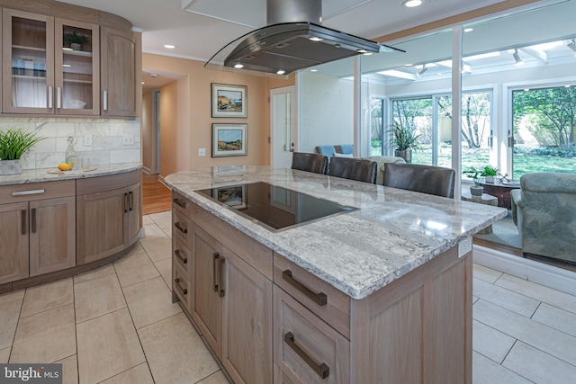 74 Wilson Rd, Princeton, NJ 08540 - kitchen with light stone counters, light tile patterned flooring, black electric cooktop, tasteful backsplash, and island exhaust hood