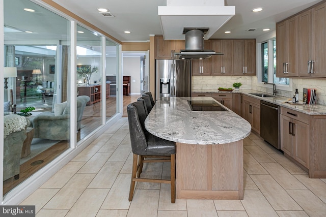 74 Wilson Rd, Princeton, NJ 08540 - kitchen with a kitchen island, island range hood, appliances with stainless steel finishes, light stone countertops, and a sink