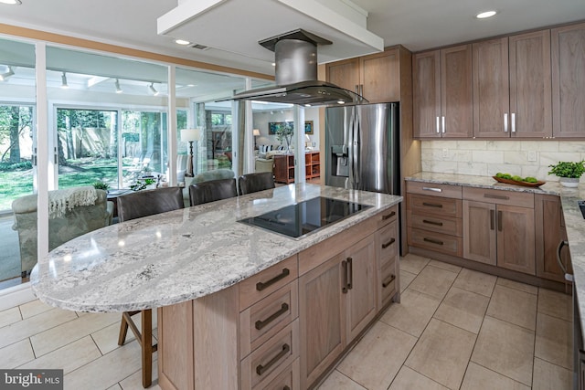 74 Wilson Rd, Princeton, NJ 08540 - kitchen featuring light tile patterned flooring, a breakfast bar, stainless steel fridge, black electric stovetop, and island range hood