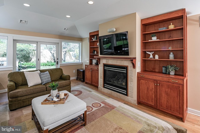 74 Wilson Rd, Princeton, NJ 08540 - living area featuring baseboards, a fireplace, and visible vents