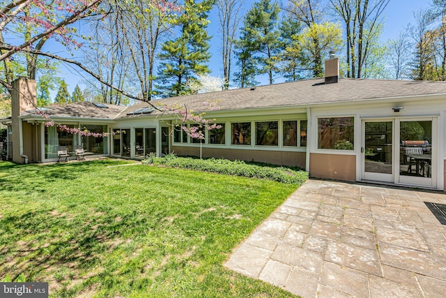 74 Wilson Rd, Princeton, NJ 08540 - back of house with a lawn, a chimney, and a patio area