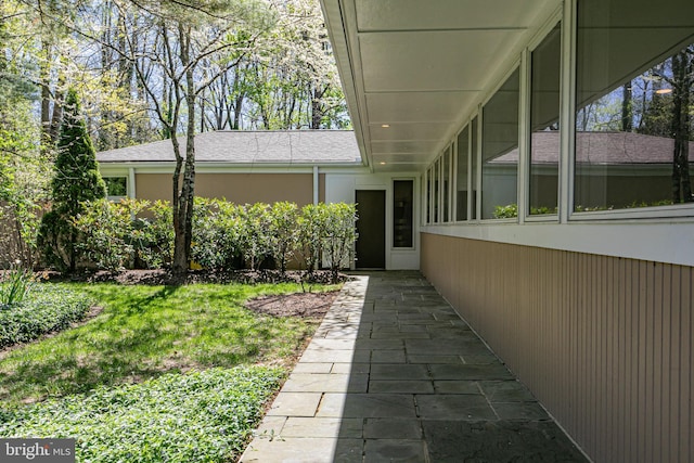 74 Wilson Rd, Princeton, NJ 08540 - exterior space featuring a lawn, roof with shingles, and stucco siding