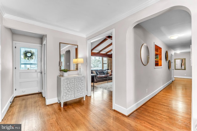 hallway featuring crown molding and light wood-type flooring