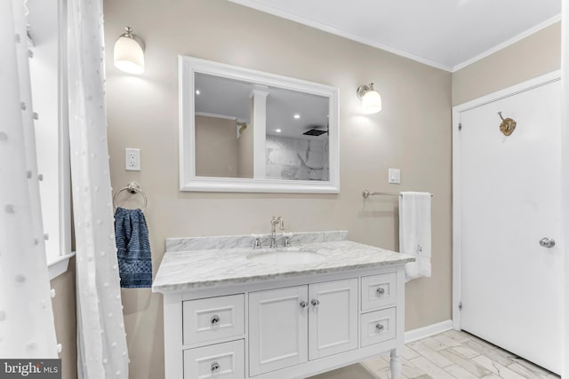 bathroom with vanity and crown molding