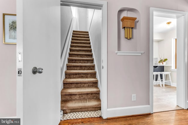 staircase featuring hardwood / wood-style flooring