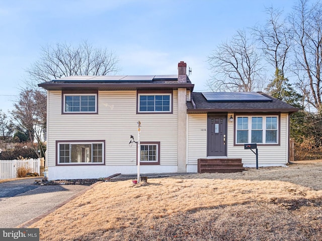 view of front of house with solar panels