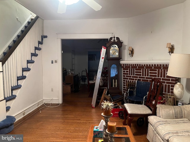 living room with ceiling fan and hardwood / wood-style floors