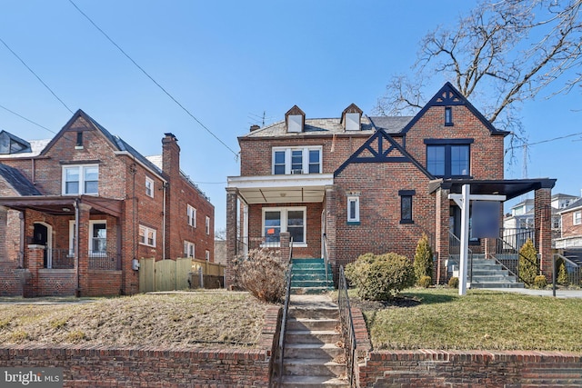 view of front of home with a porch and a front lawn