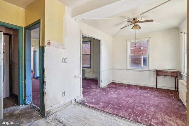 spare room featuring crown molding and ceiling fan