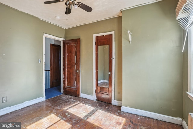 unfurnished bedroom featuring ceiling fan