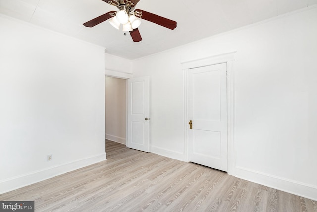 unfurnished bedroom with crown molding, light hardwood / wood-style floors, and ceiling fan