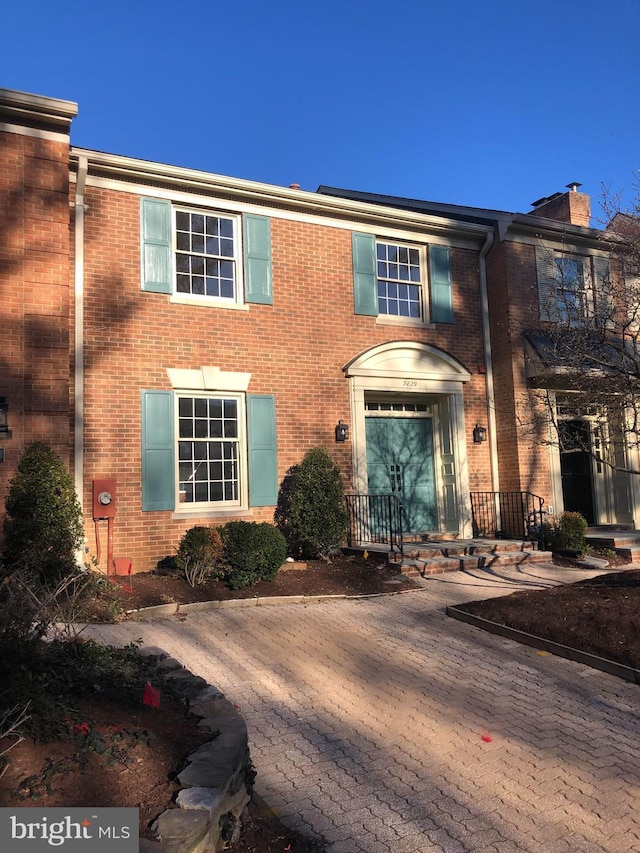 view of front of home featuring brick siding