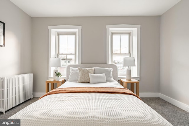 carpeted bedroom featuring radiator heating unit