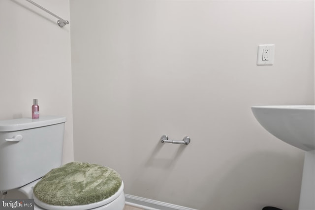 bathroom featuring toilet