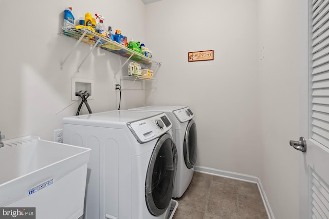 laundry room featuring sink and washing machine and dryer