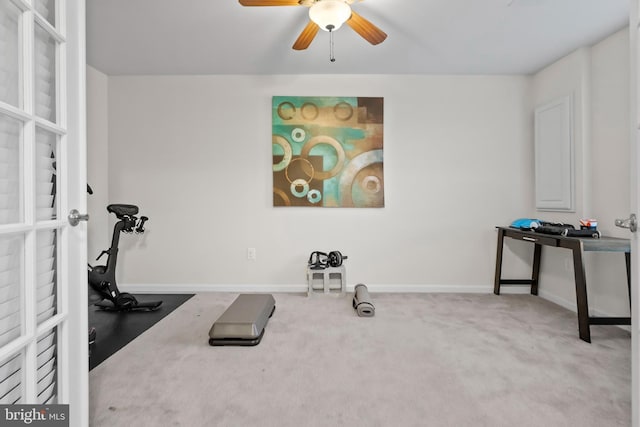 exercise area with ceiling fan and carpet flooring