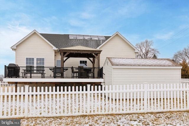 view of front facade with a wooden deck and a gazebo