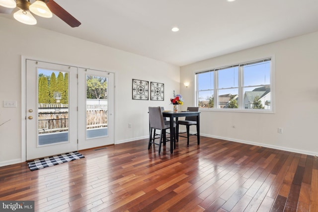 dining area with wood-type flooring, baseboards, and recessed lighting