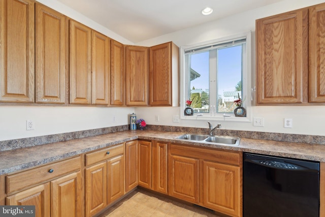 kitchen with black dishwasher, recessed lighting, dark countertops, brown cabinetry, and a sink