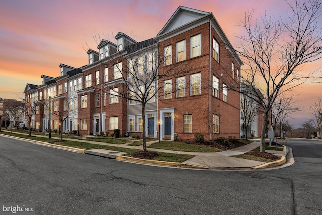 view of outdoor building at dusk