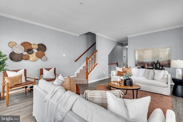 living room featuring hardwood / wood-style flooring and crown molding