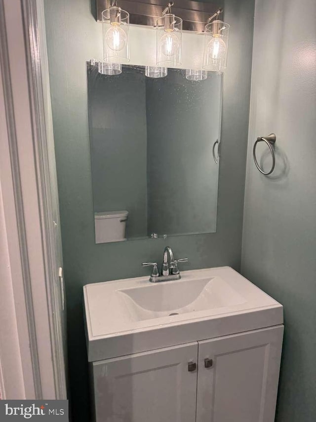 bathroom featuring vanity and toilet