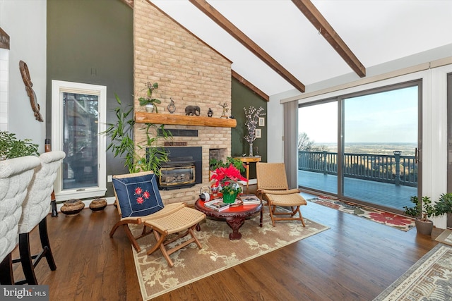 living room with a brick fireplace, beam ceiling, high vaulted ceiling, and dark hardwood / wood-style floors