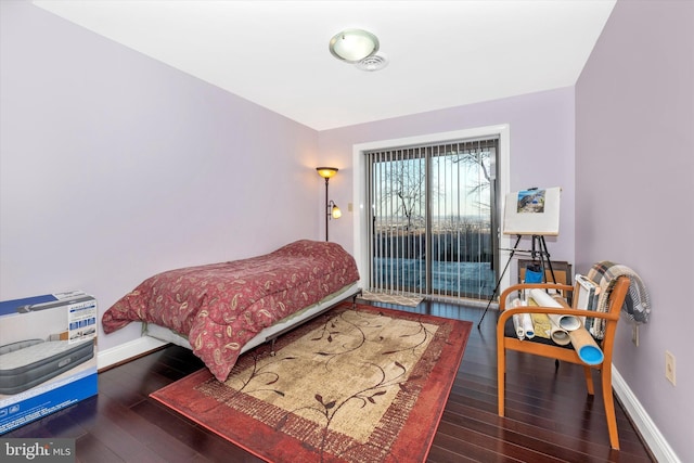 bedroom featuring dark hardwood / wood-style floors