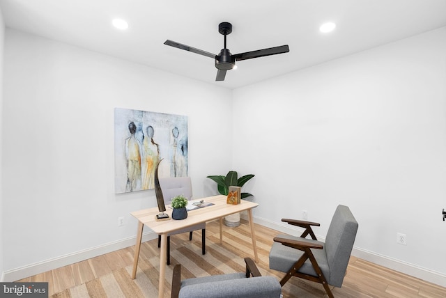 office space featuring a ceiling fan, baseboards, wood finished floors, and recessed lighting