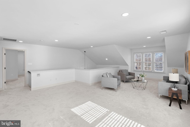 living room with vaulted ceiling, recessed lighting, visible vents, and light colored carpet