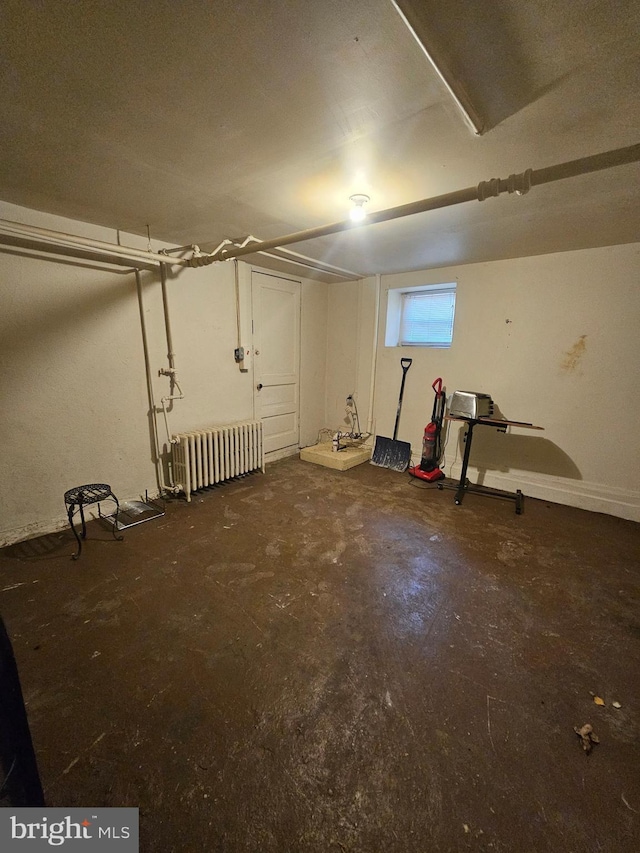 basement featuring radiator heating unit