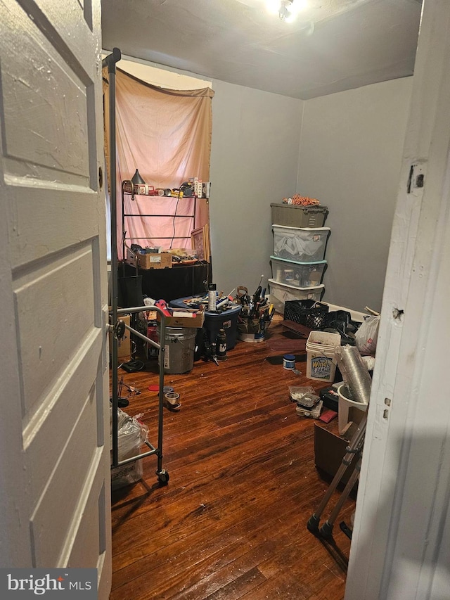 home office with wood-type flooring