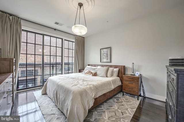 bedroom featuring dark hardwood / wood-style floors