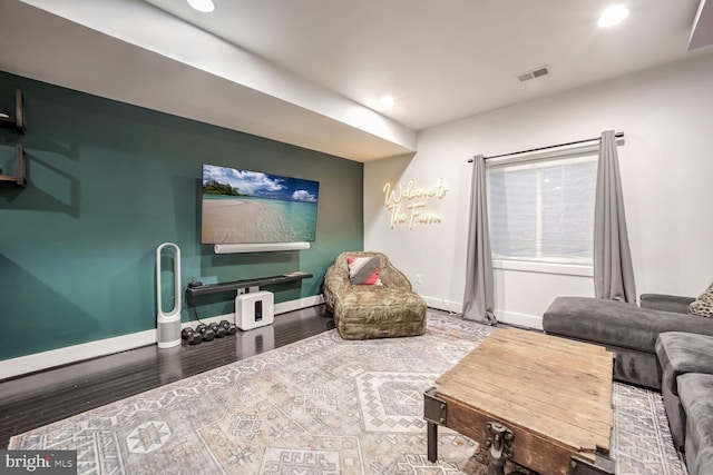 living room featuring dark wood-type flooring