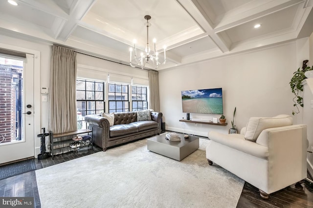 living room with beamed ceiling, coffered ceiling, dark wood-type flooring, and a notable chandelier