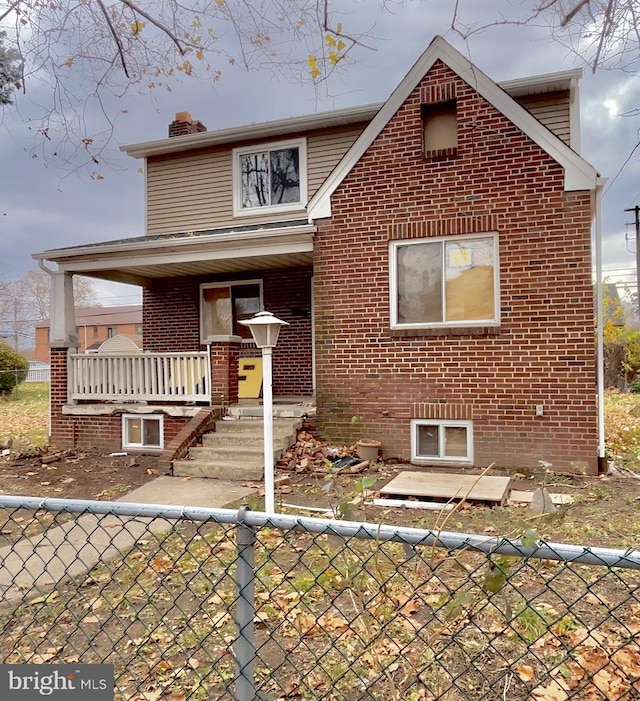 view of property featuring covered porch