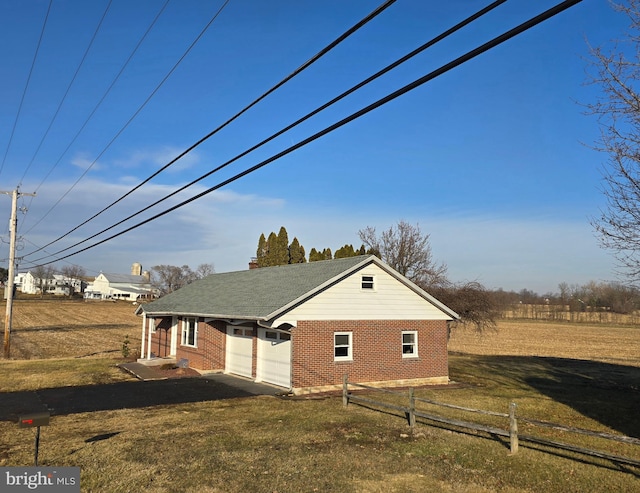 view of property exterior with a yard and a garage