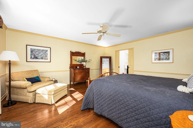 bedroom with ornamental molding, ceiling fan, and wood finished floors