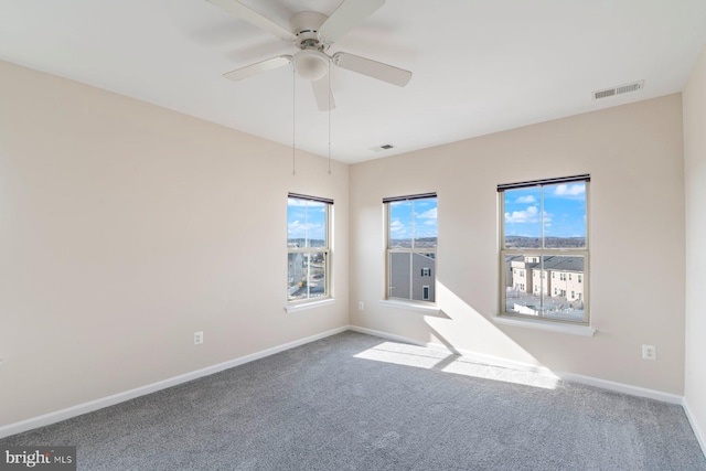 carpeted empty room with ceiling fan