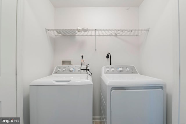 laundry room with washing machine and dryer