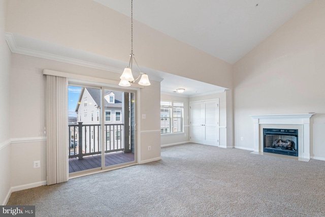 unfurnished living room with carpet, ornamental molding, and high vaulted ceiling