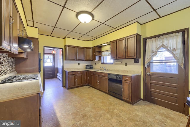 kitchen featuring a paneled ceiling, ventilation hood, dishwasher, sink, and stainless steel gas cooktop