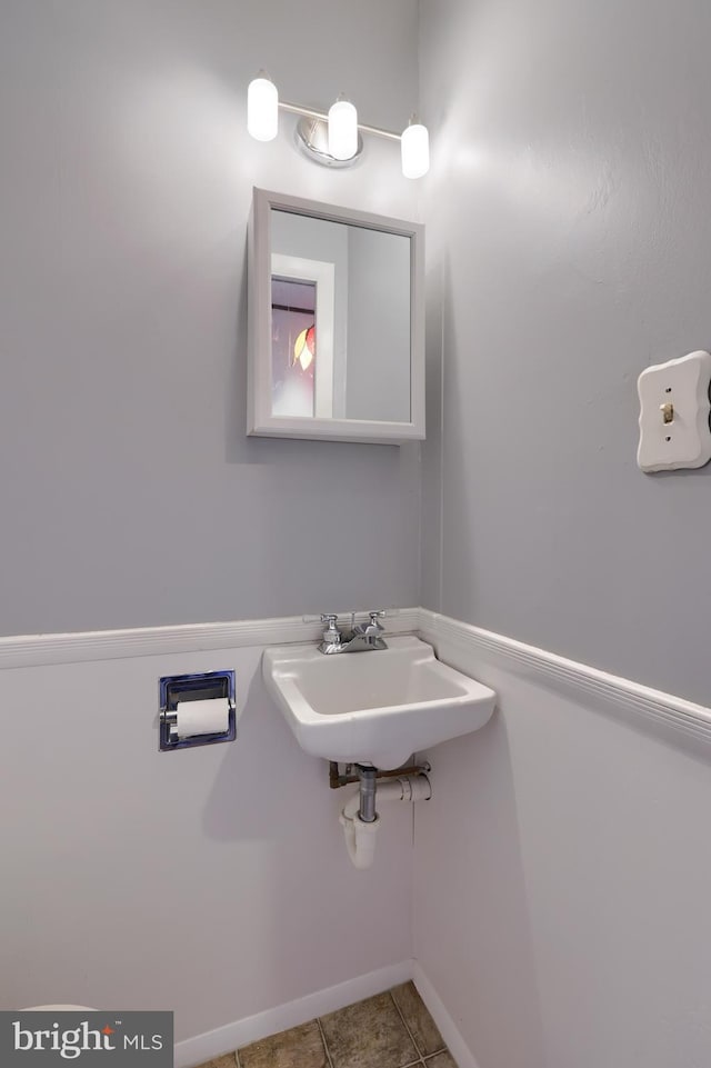 bathroom featuring tile patterned floors and sink